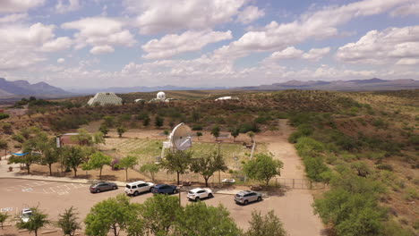 drone rises over visitor parking lot at biosphere 2 near tucson