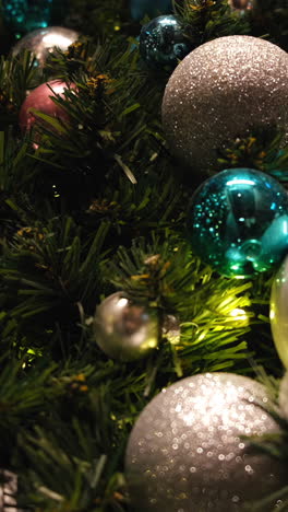 closeup of christmas ornaments on a christmas tree