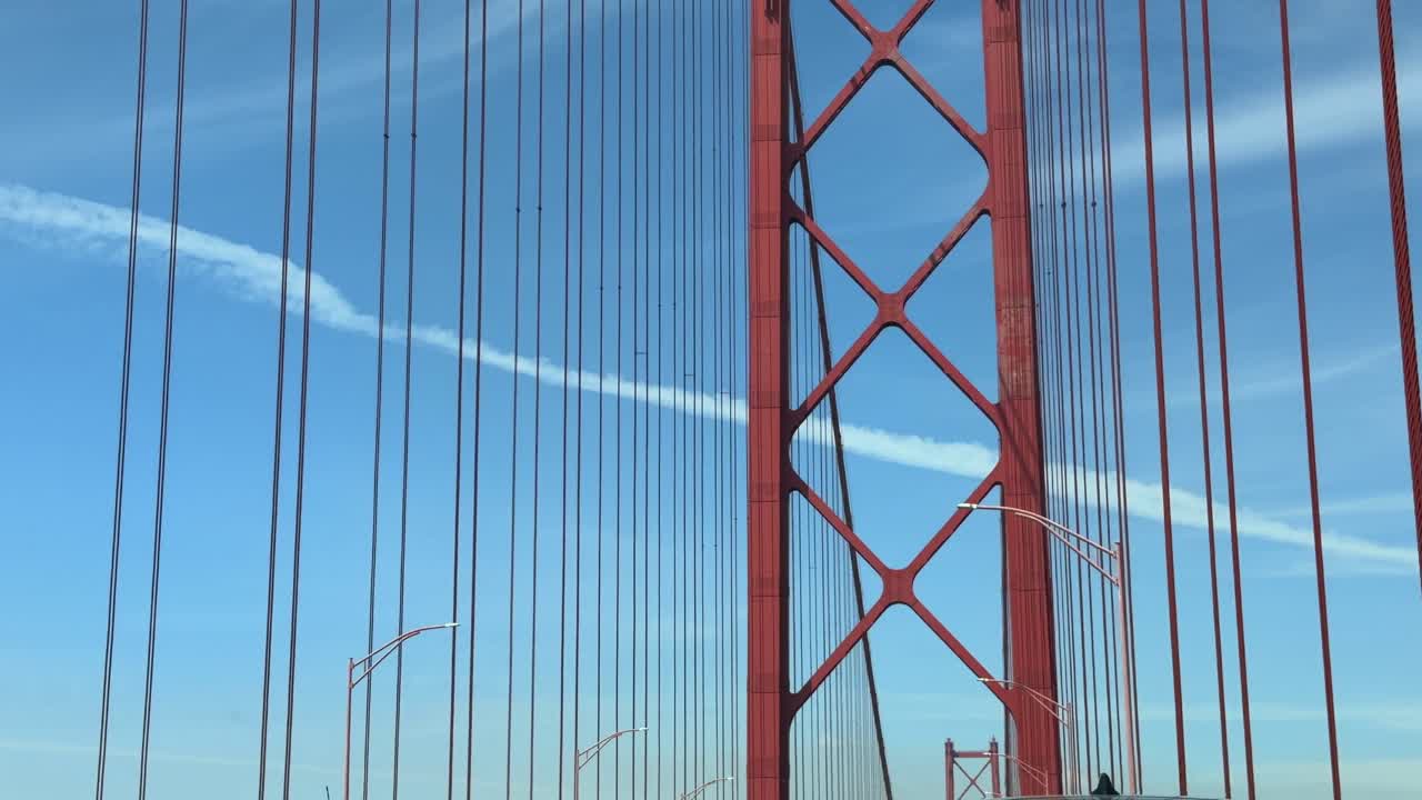 Driving Under the Iconic Red 25 de Abril Suspension Bridge