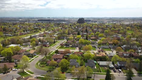 drone circling over sunny suburban neighborhood in summer