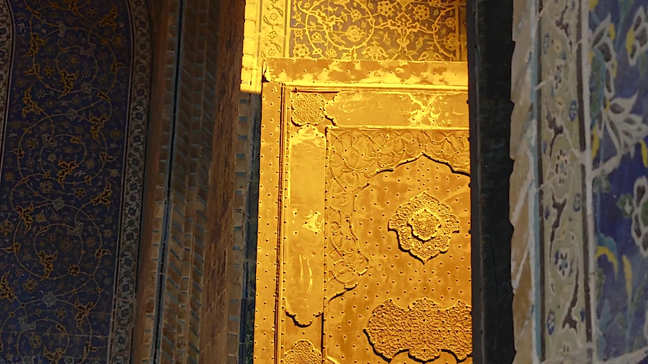 Intricate Golden Door and Blue Tilework in Historic Mosque