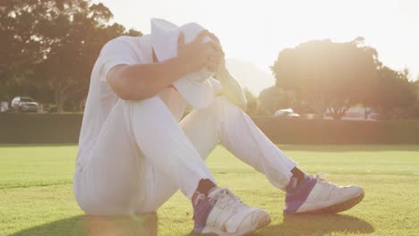 cricket player holding his head after the match