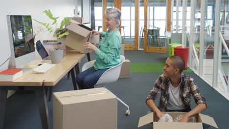 Woman and man working in a creative office