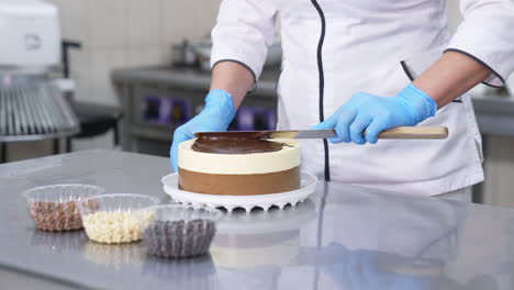 pastry chef decorating a chocolate mousse cake