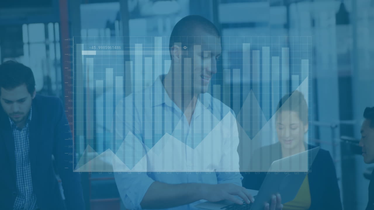 Animation of graphs, loading bar over caucasian man standing and using laptop in office