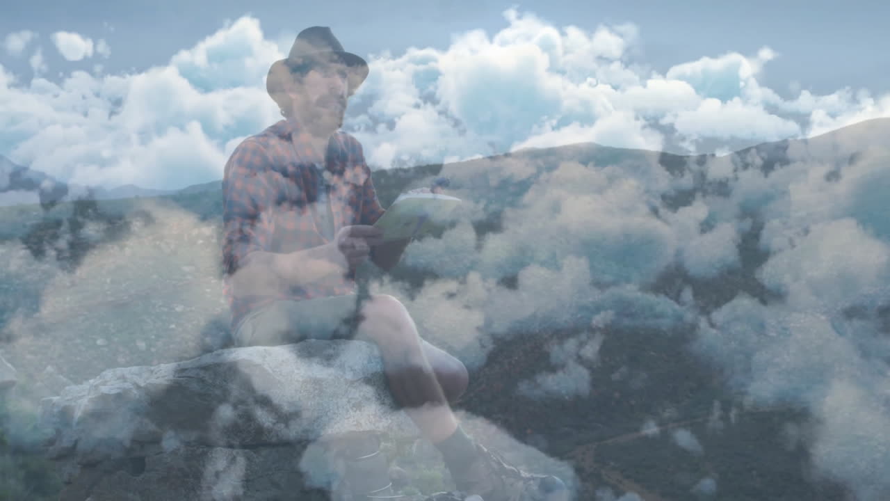 Man studying map on mountain ledge, with animated clouds and peak outline graphics for travel