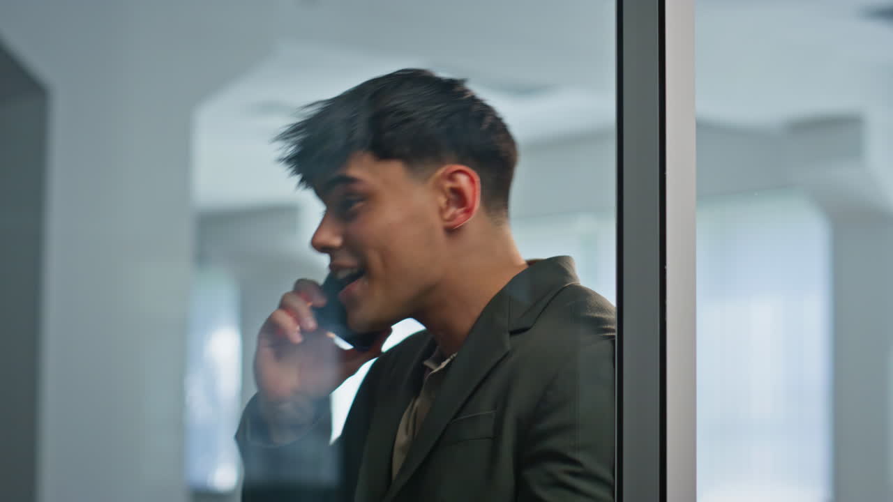 Emotional boss talking mobile phone office cabinet closeup. Businessman calling