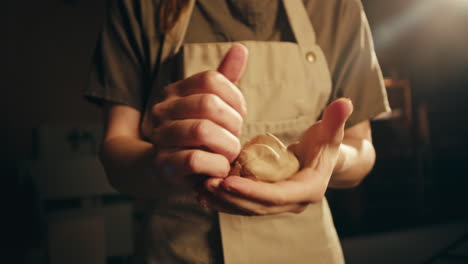 woman kneading clay