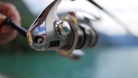 Woman-fishing-on-Fishing-rod-spinning-in-Norway.