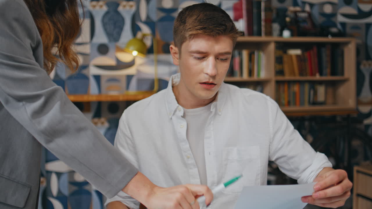 Serious designer working agency talking closeup. Startup man asking colleague