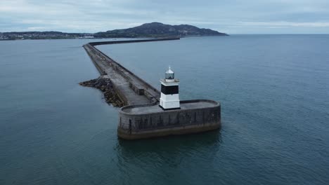 holyhead breakwater lighthouse longest concrete coastal sea protection landmark aerial view rising reverse