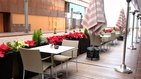 Close-up-shot-of-empty-tables-and-chairs-in-the-restaurant-during-Christmas-seasons