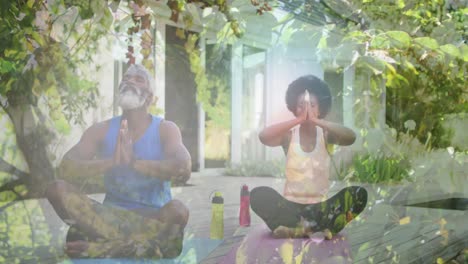 Animation-of-leaves-over-senior-african-american-man-and-woman-practicing-yoga-and-meditating