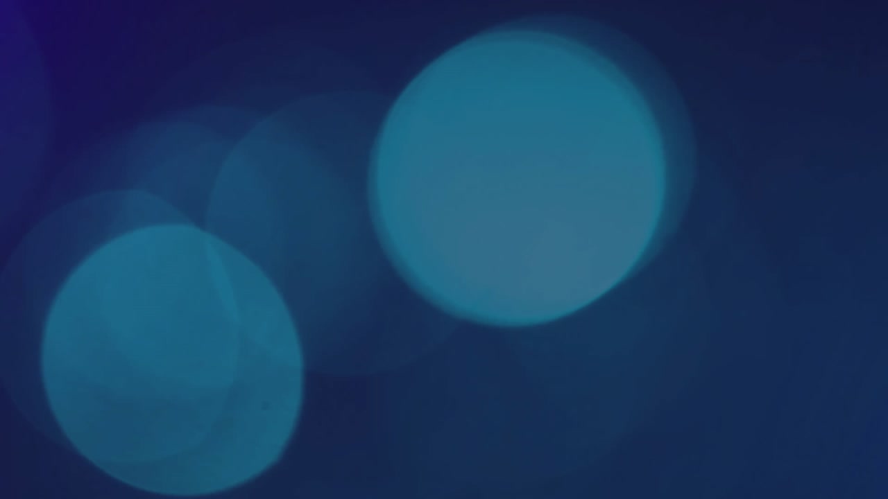 On left-side entry colorful neon arcs sweeping diagonally, layering with particles to create loop