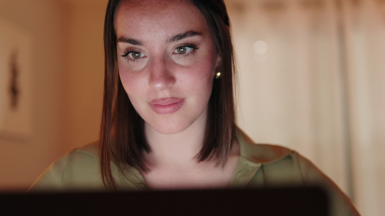 Close up of Woman Working From Home on Laptop at Night