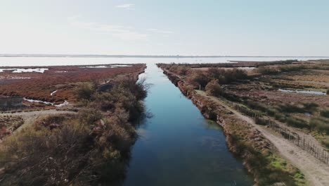 Aerial-establishing-shot-of-the-reflections-on-the-surface-of-Etang-de-l'Or