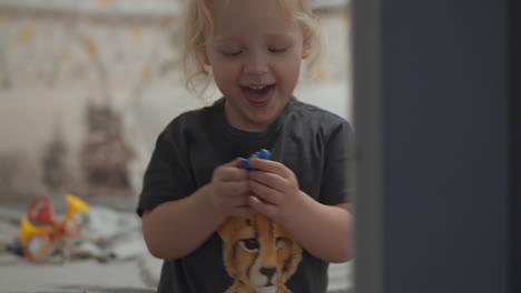 Home-portrait-of-cheerful-toddler-girl