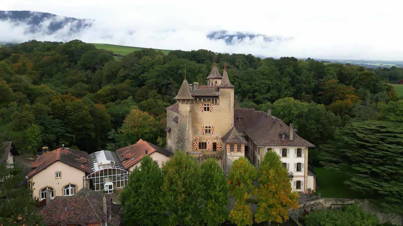Crane up tilt down drone shot of Vaumarcus Castle in Canton of Neuchatel Switzerland