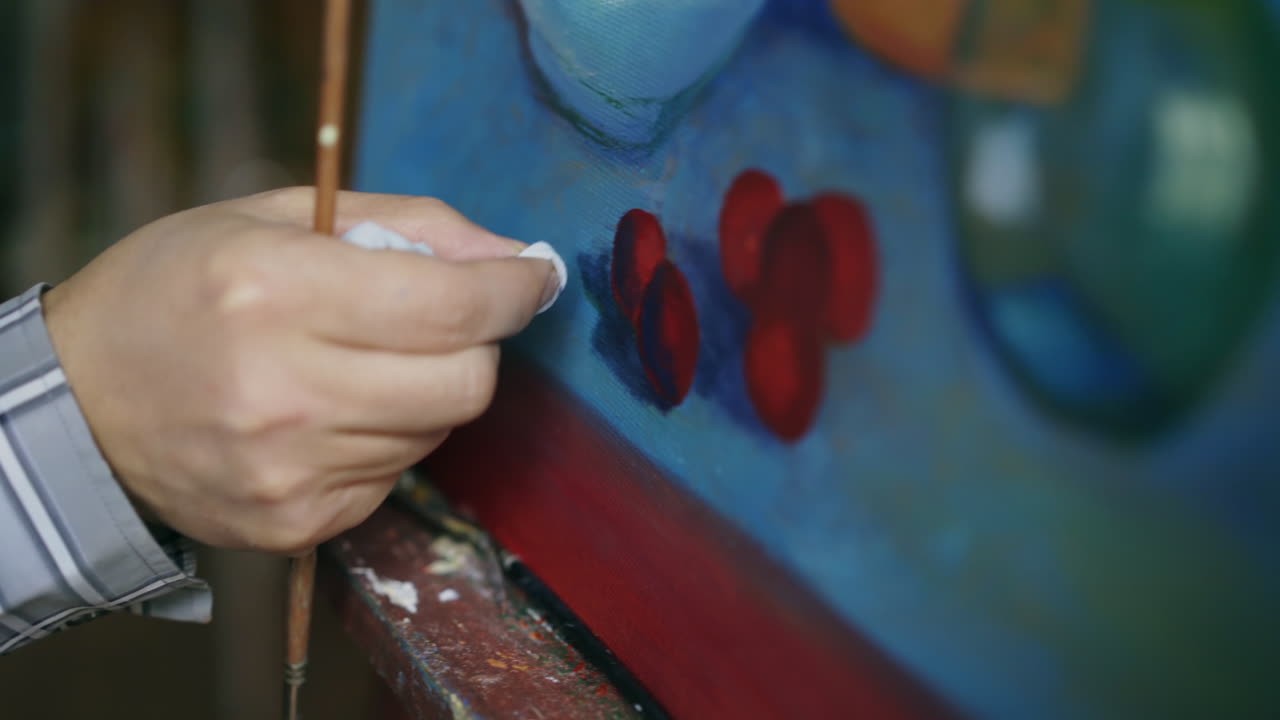 Artist painting a still life