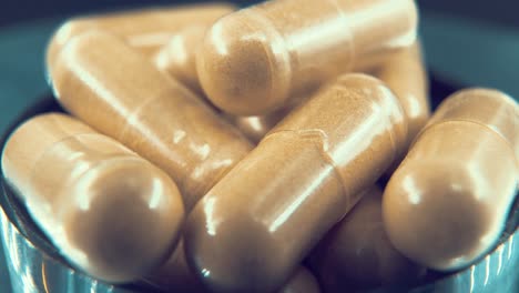 a macro close up shot in a lab of a medical capsules, organic pills on a rotating stand in a black shiny bowl, studio light, 4k video