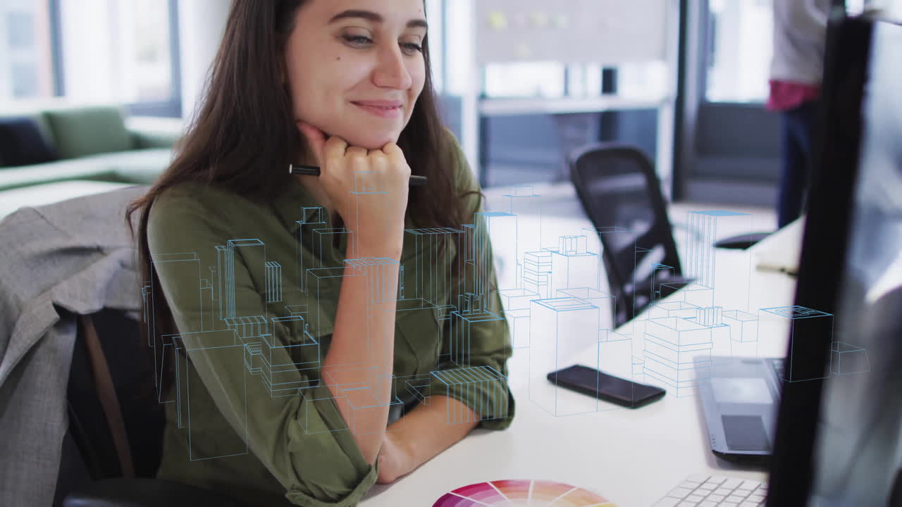 Viewing digital architectural models on computer screen, woman smiling at desk