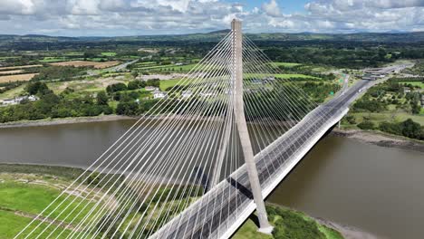 High-drone-establishing-shot-of-a-suspension-bridge-over-the-River-Suir-at-Waterford-Ireland