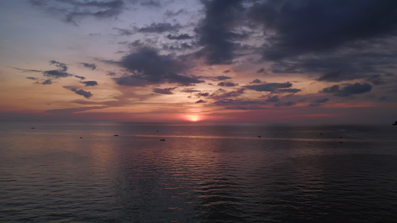 Sunset on sea beach, orange clouds colored