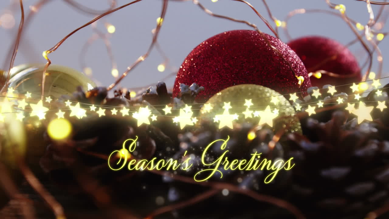 Animation of seasons greetings text over christmas tree decorations