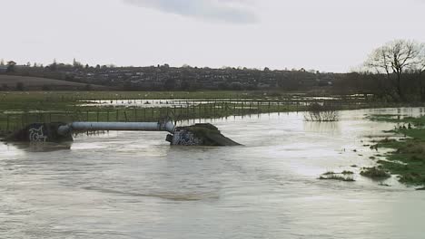 the river eye in melton mowbray, leicestershire, england, uk swollen and fast flowing after a day of torrential rain fall
