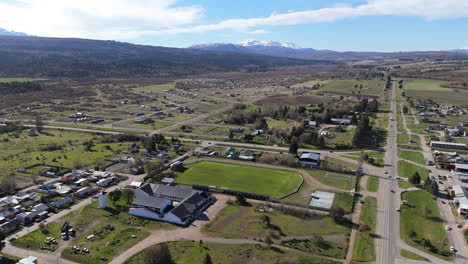 a stunning drone perspective of estadio el jardín, home of club cnel. fontana, showcasing the football stadium’s structure and surrounding landscape. a perfect shot for sports and enthusiasts.