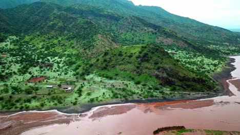 idyllic coastline of lake natron in the great rift valley in tanzania - aerial drone shot