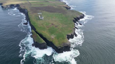 loophead or loop head with lighthouse in wild landscape, ireland