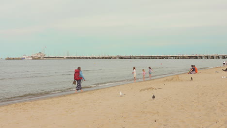 families enjoying at sopot beach in sopot, poland on a summer sunny day.