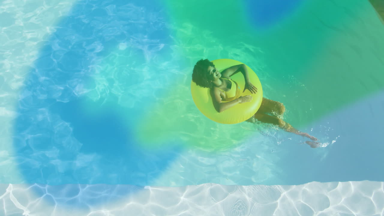 woman floating on inflatable tube in swimming pool, overlaying health chart animations