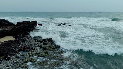 Waves-splashing-on-sea-shore-rocks