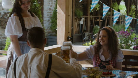 people celebrating oktoberfest with beer and food