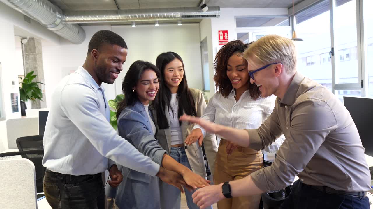 Diverse Business Team Celebrating Success in Modern Office