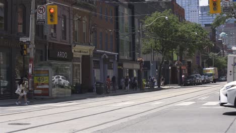 toronto, canada, video - the city life of queen street west during a sunny day