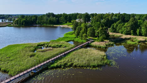 biržai bridge leading to astravo manor in lithuania, aerial view