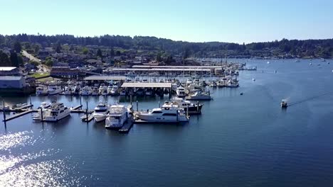 steady-tilt-down-aerial-shot-of-boats-in-Gig-Harbor-marina,-Washington,-USA