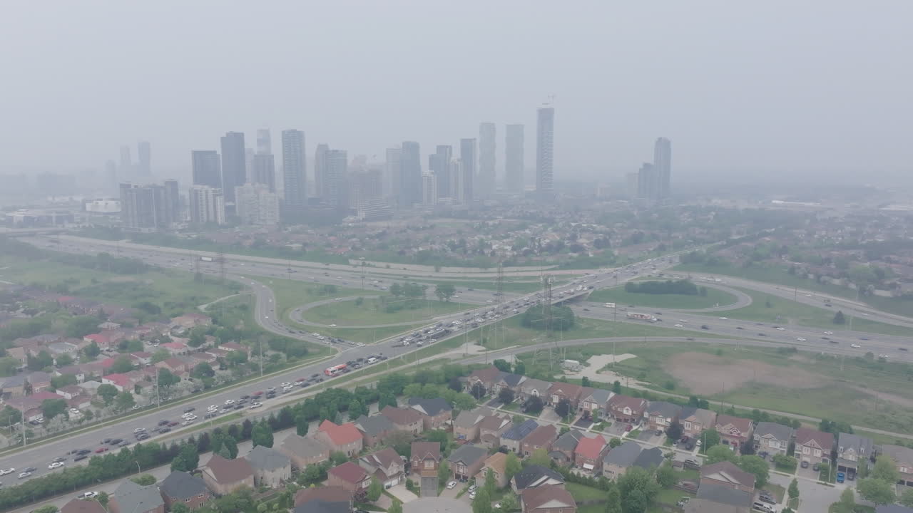 Wildfire smoke causes poor air quality in Mississauga, with a hazy city skyline
