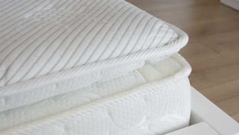 close-up of a white mattress topper