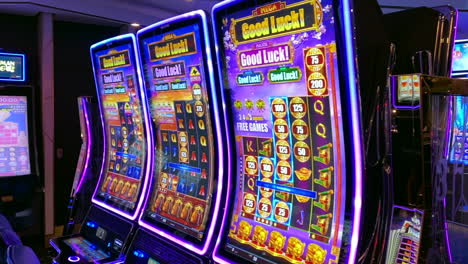 cruise ship casino full of slot machines with flashing lights and jackpot