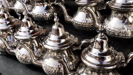 traditional moroccan teapots in a shop in the souk of the medina in marrakech, morocco.