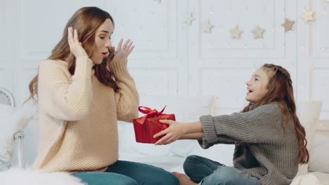 cheerful woman getting new year present in luxury house.