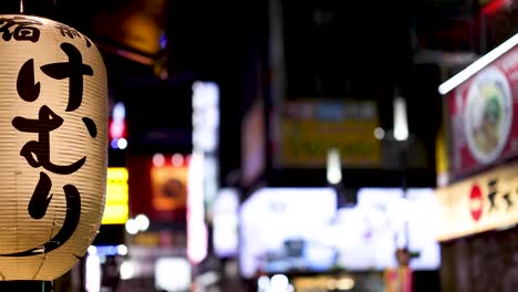 japanese lantern glowing against a city backdrop