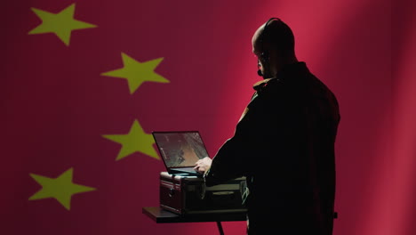 chinese army military dispatcher looking at surveillance transmission