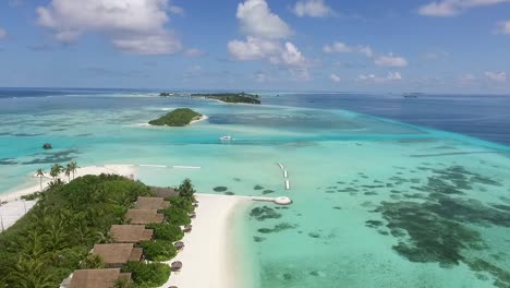 drone filming a sailing boat between the maldives islands full hd