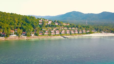 4k aerial front view of surin beach, phuket