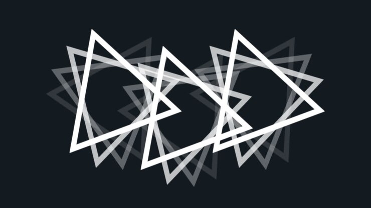 Animazione di molteplici triangoli bianchi che ruotano in un ciclo continuo su sfondo nero.